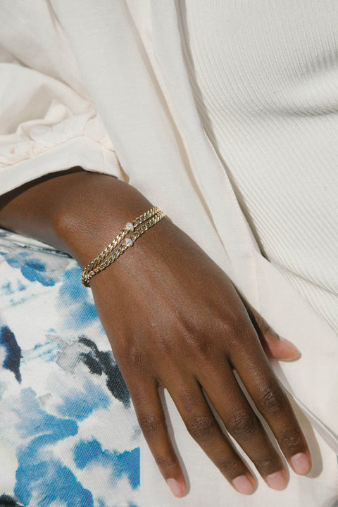 A model wearing Chuva necklace, 14 recycled gold lab-grown diamond chain necklace from The Future Rocks