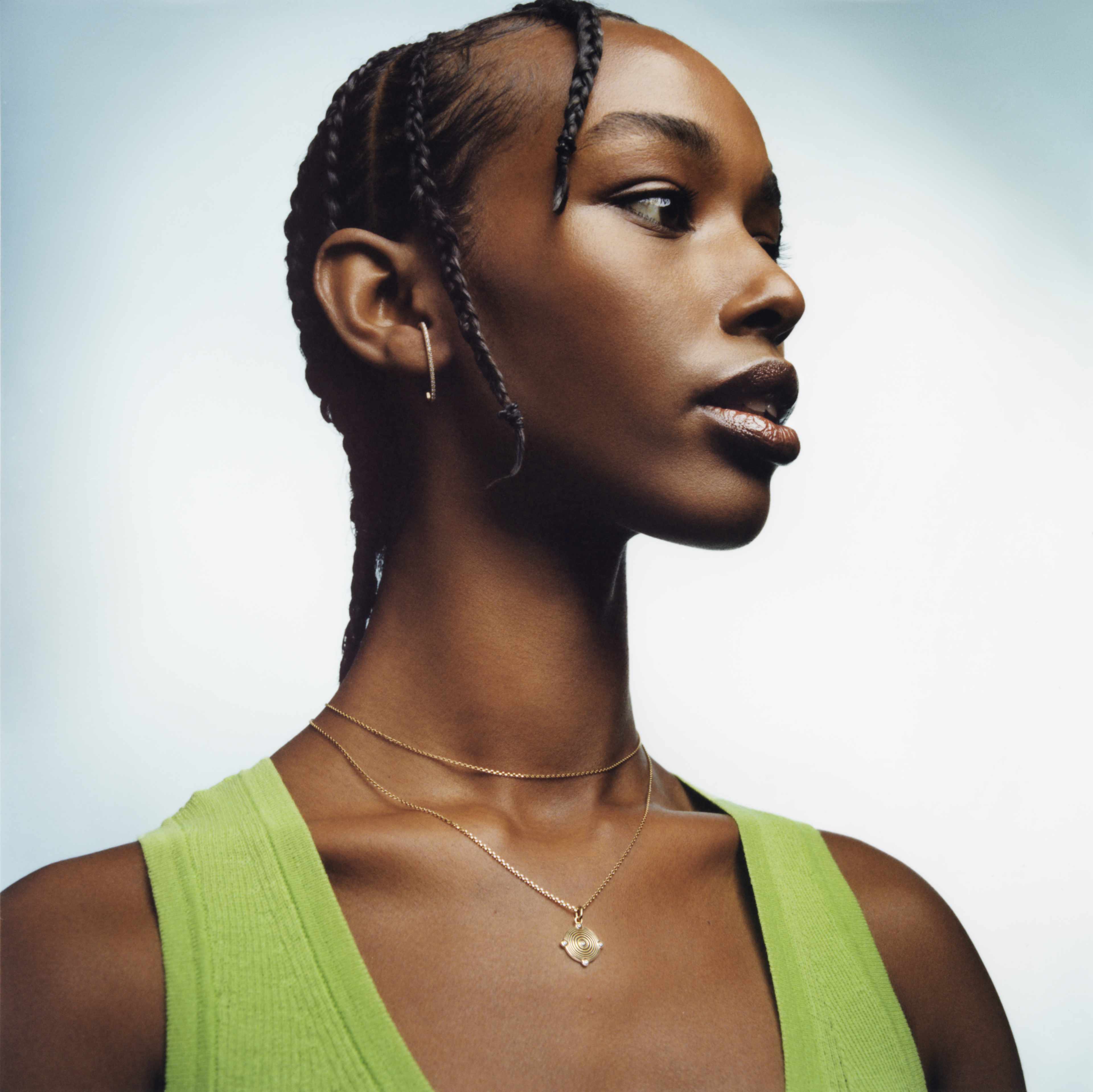 A model wearing jewelry from women-led jewelry brands