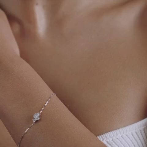 A model wearing Emçi midi bracelet - 18k recycled gold lab-grown diamond cluster bracelet from The Future Rocks