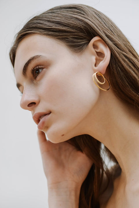 A model wearing Cleopatra double hoop earrings - 9k recycled gold lab-grown diamond earrings - The Future Rocks