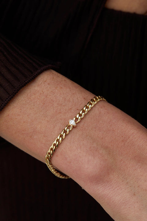 A model wearing Chuva chunky chain bracelet - 14k recycled gold lab-grown diamond solitaire bracelet from The Future Rocks